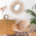 Rundt solspejl i håndflettet rattan på væg — Bo Studio